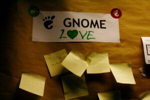 A photo of post-it notes below a sign reading "GNOME Love"