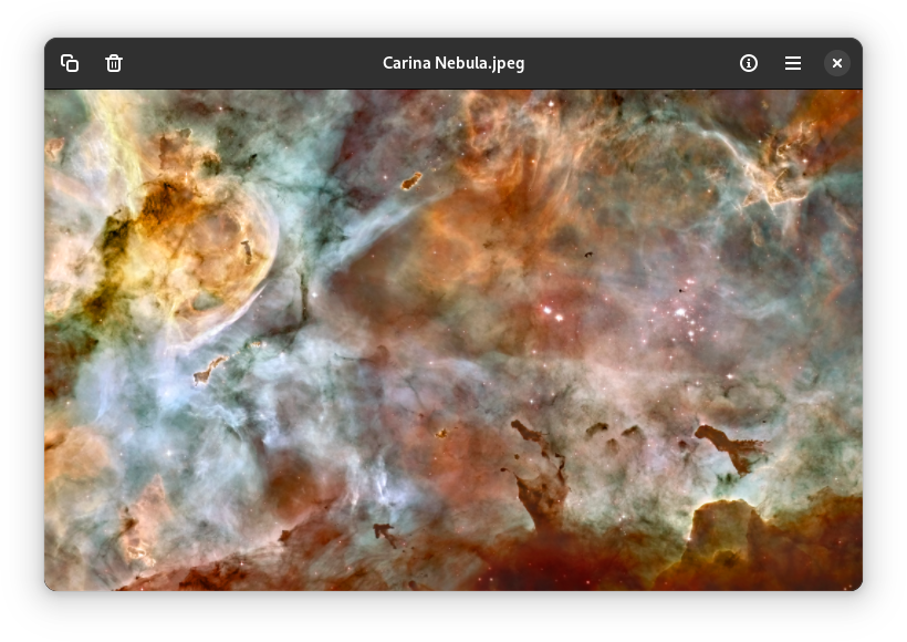 App window with a minimalist headerbar on top and an image of the Carina nebula below.